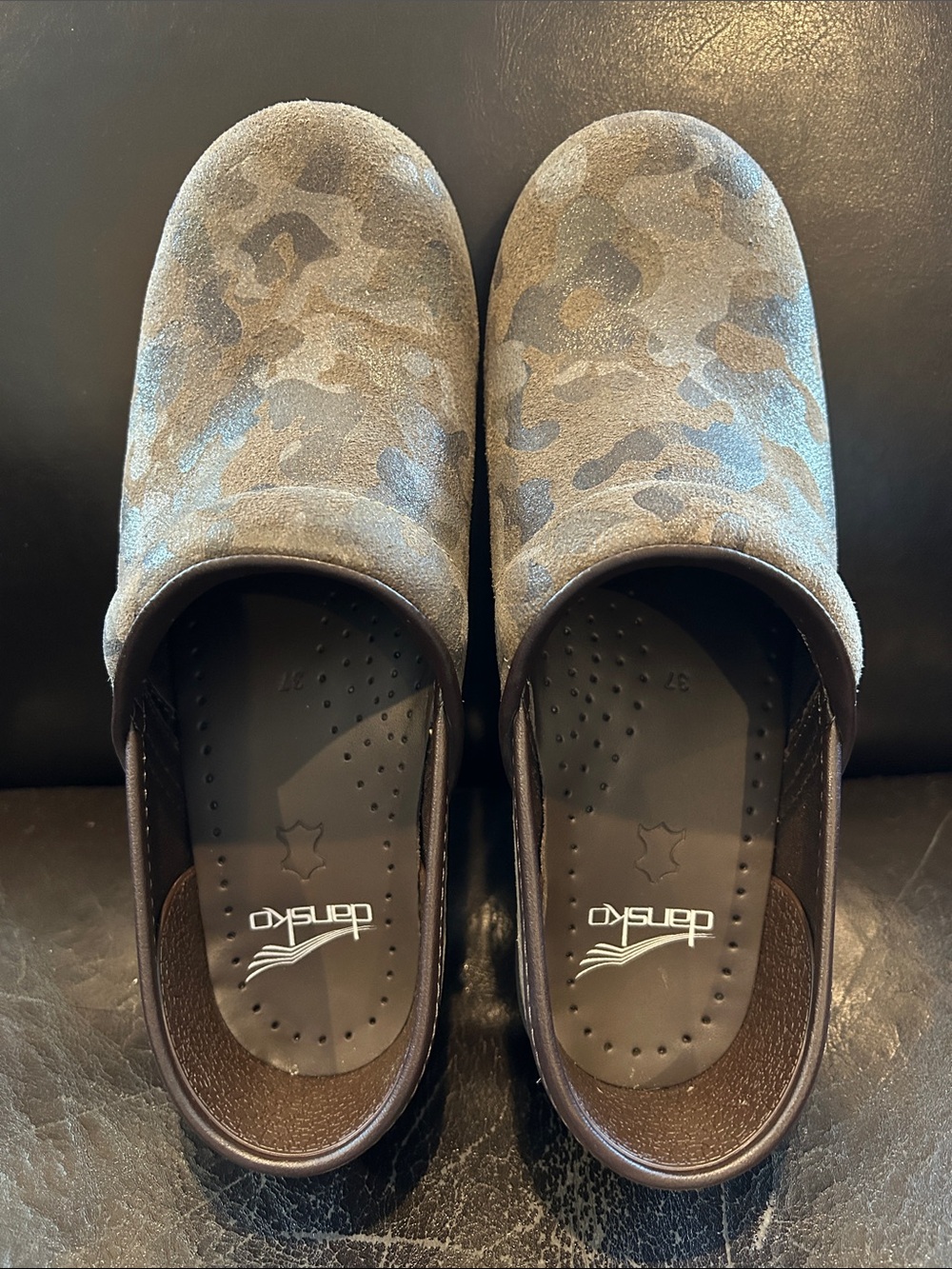 Dansko Suede Camo Slip-On Clogs in black and Brown